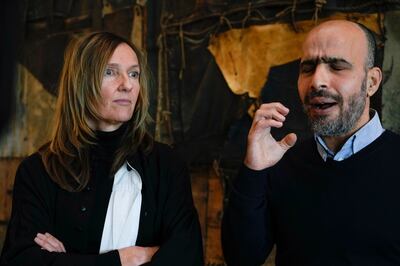 Plaintiff Ismail Ziada, right, and his lawyer Liesbeth Zegveld, after the Dutch appeals court ruling. AP