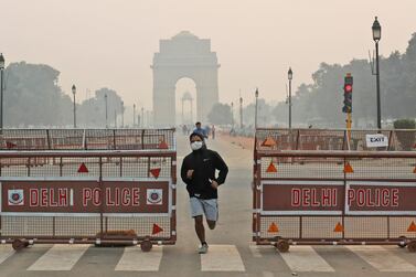 A jogger in New Delhi wears a pollution mask as he runs in the Indian capital the morning after the Hindu festival of Diwali. AP Photo