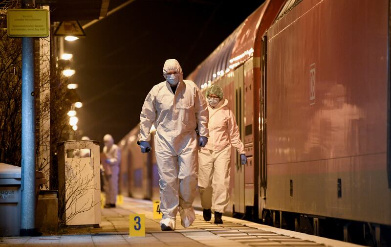 Forensic experts at Brokstedt station in Germany. Reuters