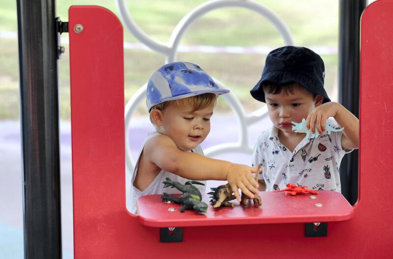 Dubai, United Arab Emirates - Reporter: N/A. News. Oliver and Jake (R) play in the park as children's play areas start to open around Dubai. Wednesday, June 24th, 2020. Dubai. Chris Whiteoak / The National