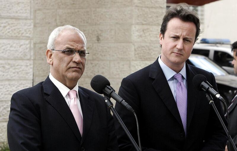 Leader of the Conservative Party David Cameron and Chief Palestinian spokesman Saeb Erekat listen as a journalist asks a question in Ramallah, Palestine on the last day of his two-day tour of the area on March 2, 2007. Reuters