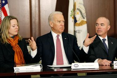 Joe Biden speaks at a White House event in 2015, when he was vice president. Alejandro Mayorkas, then deputy secretary of the Department of Homeland Security, now nominated to head the department, is pictured with him, along with Amy Pope, then senior director of the National Security Agency. 