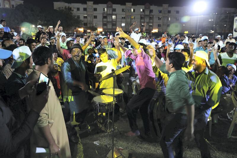 DUBAI , UNITED ARAB EMIRATES, September 27 , 2018 :- Workers enjoying the DU  & Western Union Camp Ka Champ held at Nuzul Accommodation in Jabel Ali Industrial area in Dubai. ( Pawan Singh / The National )  For News/Big Picture/Instagram/Online. Story by Patrick