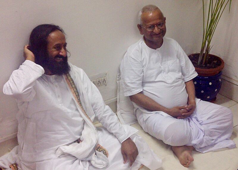 Indian spiritual leader Sri Sri Ravi Shankar, left, calls on India's most prominent anti-corruption crusader Anna Hazare inside the Tihar prison complex where Hazare is holding his hunger strike in New Delhi, India, Wednesday, Aug.17, 2011. Police arrested Hazare on Tuesday to scuttle his plans to hold a public fast and tried to free him hours later. However, Hazare refused to leave the jail unless he was granted permission to hold a public demonstration aimed at forcing lawmakers to strengthen a draft bill that would create an anti-corruption ombudsman. Prime Minister Manmohan Singh lashed out at Hazare Wednesday, accusing the fasting activist of trying to circumvent democracy by demanding Parliament pass a reform bill he supports. (AP Photo) *** Local Caption ***  India Corruption Protest.JPEG-042d5.jpg