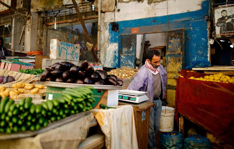 A Palestinian man selling vegetables waits for costumers at the largest popular market in Gaza City on February 13, 2018.
A senior United Nations official in January warned the Palestinian coastal enclave of the Gaza Strip was on the verge of "full collapse". UN Middle East peace envoy Nickolay Mladenov said a key to saving Gaza from disaster was restoring the government of Palestinian president Mahmud Abbas to power there, a decade after it was forced out by the militant Islamist movement Hamas. Gaza, battered since 2008 by three wars between Israel and Palestinian militants, suffers from shattered infrastructure, a strict Israeli blockade and massive unemployment. / AFP PHOTO / MOHAMMED ABED