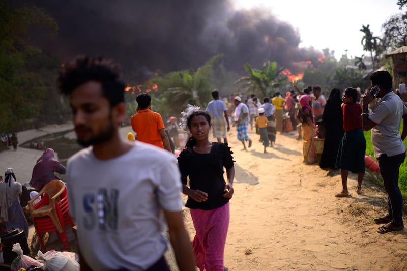 The fire raced through the crammed camp on Sunday, leaving thousands homeless. AP