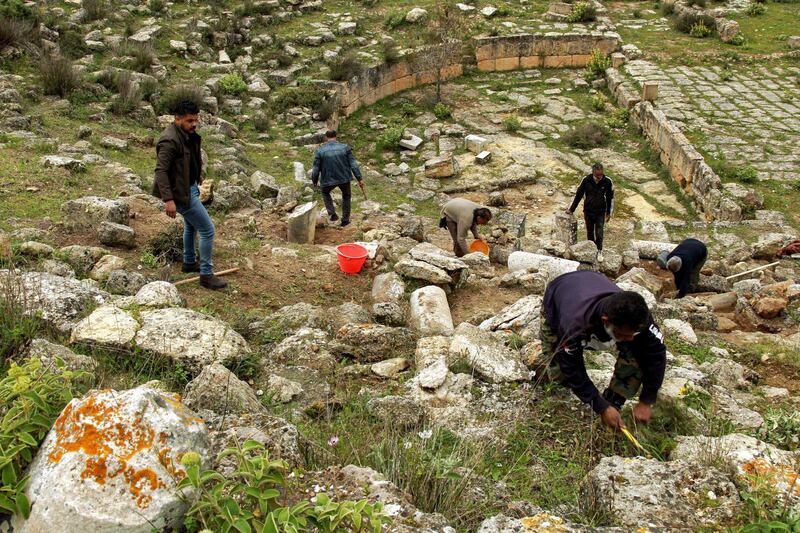 Men work on maintaining the site of the ruins of Libya's ancient eastern city of Cyrene. The city was added to Unesco's World Heritage List in 1992. AFP