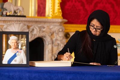 Governor-General of Belize Dame Froyla Tzalam signs a book of condolence at Lancaster House in London following the death of Queen Elizabeth. PA