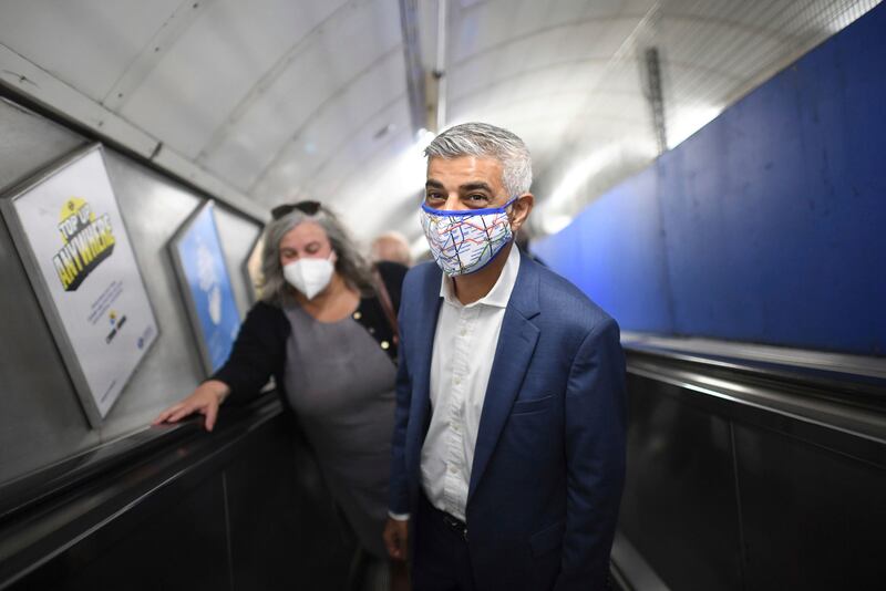 Mayor of London Sadiq Khan wears a mask at Bond Street underground station in central London. He said that passengers on the capital’s buses and trains must continue to wear face masks.