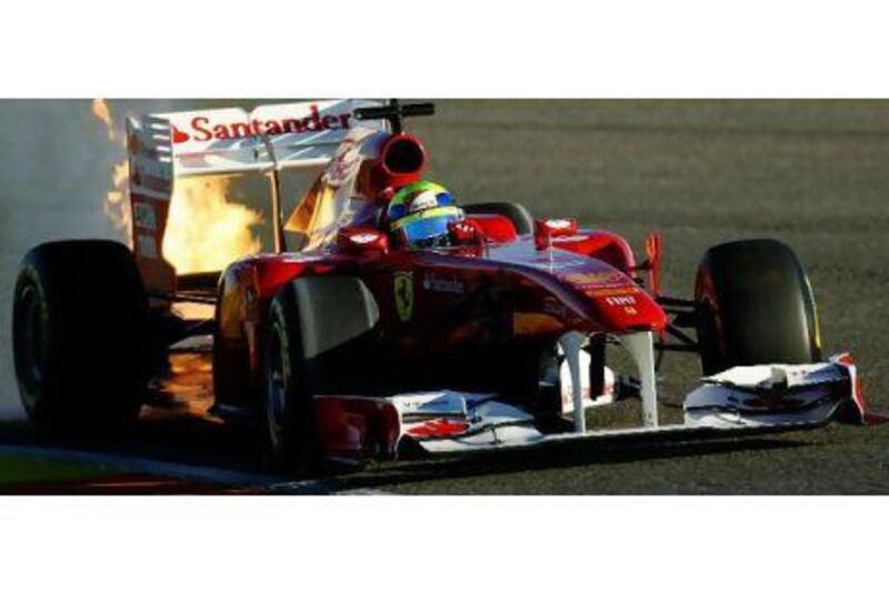 Flames leap from Felipe Massa's Ferrari yesterday. Paul Gilham / Getty Images
