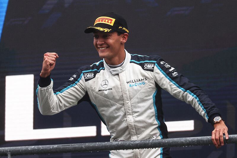 Williams' British driver George Russell celebrates his second-place. AFP