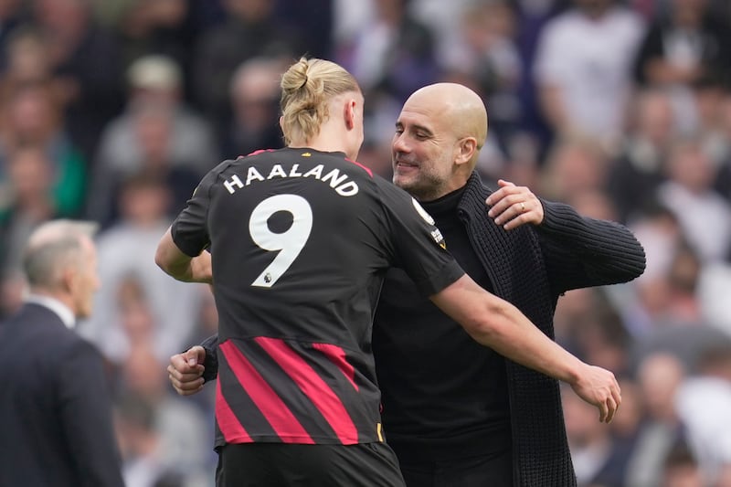 City manager Pep Guardiola embraces Erling Haaland after the game. AP