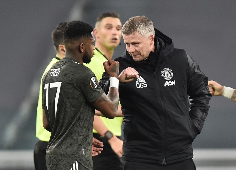 Manchester United manager Ole Gunnar Solskjaer bumps fists with Fred after the win over Real Sociedad in the Europa League round of 32 first leg on Thursday, February 18, 2021. Reuters