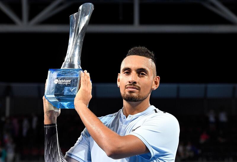 BRISBANE, AUSTRALIA - JANUARY 07:  Nick Kyrgios of Australia holds up the winners trophy after winning the Men's Final match against Ryan Harrison of the USA during day eight of the 2018 Brisbane International at Pat Rafter Arena on January 7, 2018 in Brisbane, Australia.  (Photo by Bradley Kanaris/Getty Images)