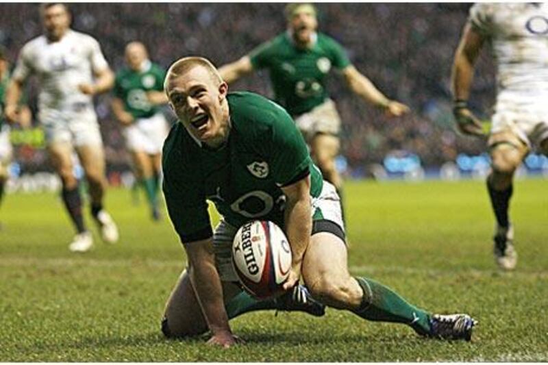 Wing Keith Earls celebrates scoring Ireland's second try against England in a match in which they outscored the hosts by three tries to one. The win puts Declan Kidney's side back on track to defend their Six Nations crown.