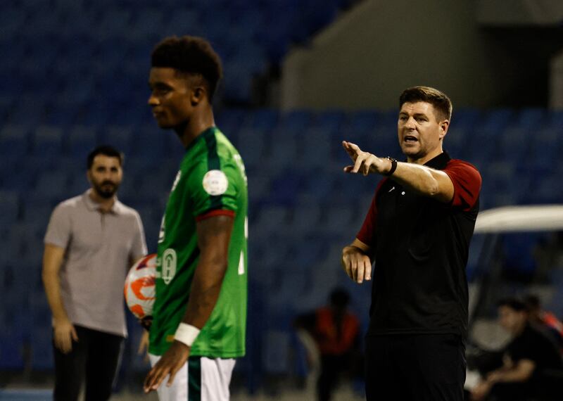 Al Ettifaq coach Steven Gerrard gives instructions as Demarai Gray waits to take a throw-in. Reuters