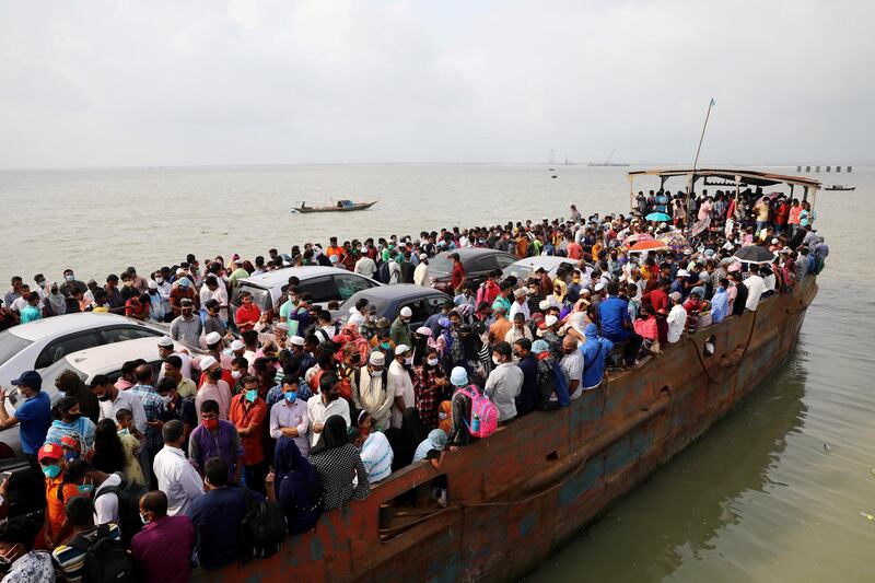 Migrant people are seen on board of an overcrowded ferry, as they go home to celebrate Eid al-Fitr in Munshiganj, Bangladesh. Reuters