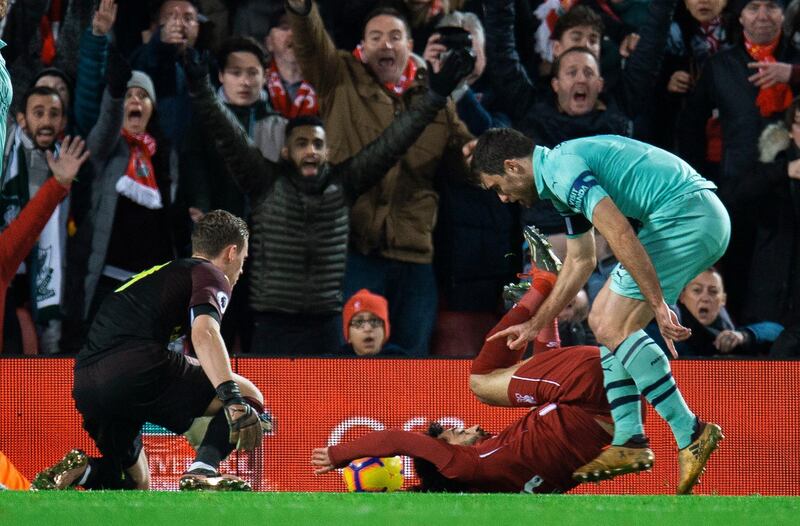 epa07253397 Liverpool's Mohamed Salah is brought down in action the Arsenal area for the penalty during the English Premier League soccer match between Liverpool and Arsenal at the Anfield in Liverpool, Britain, 29 December 2018.  EPA/PETER POWELL EDITORIAL USE ONLY. No use with unauthorized audio, video, data, fixture lists, club/league logos or 'live' services. Online in-match use limited to 120 images, no video emulation. No use in betting, games or single club/league/player publications