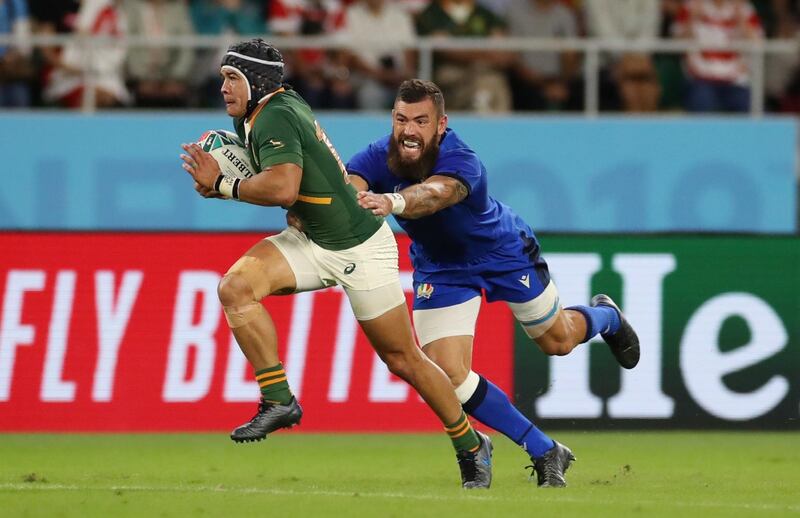 Rugby Union - Rugby World Cup 2019 - Pool B - South Africa v Italy - Shizuoka Stadium Ecopa, Shizuoka, Japan - October 4, 2019. South Africa's Cheslin Kolbe in action with Italy's Jayden Hayward. REUTERS/Peter Cziborra