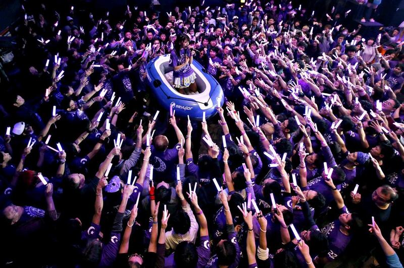 Moa Tsukino, a member of Japanese pop group Kamen Joshi (Masked Girls), performs on a raft. The Tokyo-based all female band has 18 members, split into three groups that perform across Japan and elsewhere in Asia.   Toru Hanai / Reuters