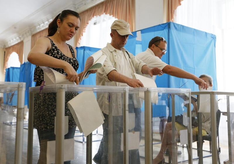 Ukrainians vote in the presidential election at polling station in Kiev on May 25, 2014. Gleb Garanich / Reuters