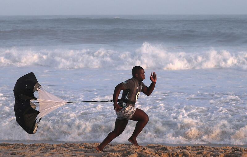 A man exercises on Recreio dos Bandeirantes beach, amid the coronavirus outbreak, in Rio de Janeiro, Brazil. Reuters