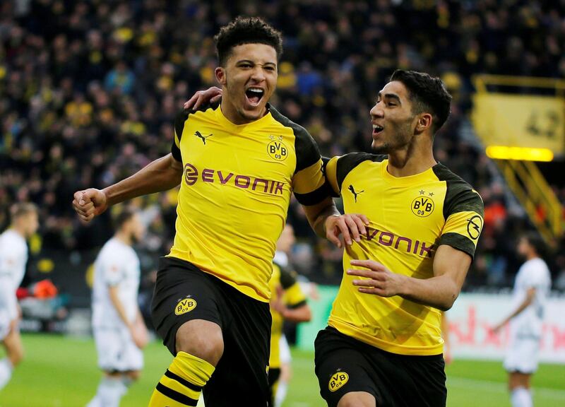 Soccer Football - Bundesliga - Borussia Dortmund v TSG 1899 Hoffenheim - Signal Iduna Park, Dortmund, Germany - February 9, 2019  Borussia Dortmund's Jadon Sancho celebrates scoring a goal with Achraf Hakimi before it is disallowed after a referral to VAR   REUTERS/Leon Kuegeler  DFL regulations prohibit any use of photographs as image sequences and/or quasi-video     TPX IMAGES OF THE DAY