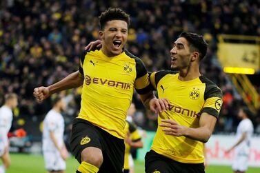 Soccer Football - Bundesliga - Borussia Dortmund v TSG 1899 Hoffenheim - Signal Iduna Park, Dortmund, Germany - February 9, 2019 Borussia Dortmund's Jadon Sancho celebrates scoring a goal with Achraf Hakimi before it is disallowed after a referral to VAR REUTERS/Leon Kuegeler DFL regulations prohibit any use of photographs as image sequences and/or quasi-video TPX IMAGES OF THE DAY