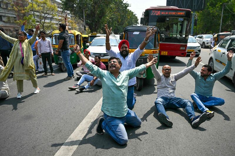 Supporters of Delhi's Chief Minister Arvind Kejriwal block a road as they protest against his arrest, in New Delhi. AFP