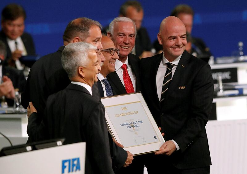 FIFA President Gianni Infantino (R) poses for a picture with officials after the announcement, that the 2026 FIFA World Cup will be held in the United States, Mexico and Canada, during the 68th FIFA Congress in Moscow, Russia June 13, 2018. REUTERS/Sergei Karpukhin     TPX IMAGES OF THE DAY