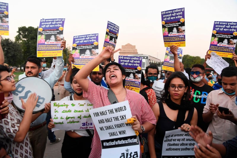 Demonstrators shout slogans during a protest following accusations of Indian Police forcibly cremating the body of a 19-year-old woman victim, who was allegedly gang-raped by four men in Bool Garhi village of Uttar Pradesh state, near India Gate in New Delhi on September 30, 2020. Indian police were accused on September 30 of forcibly cremating the body of a 19-year-old alleged gang-rape victim as anger grew over the latest horrific sexual assault to rock the country. The teenager from India's marginalised Dalit community suffered serious injuries in a brutal sexual attack two weeks ago, according to her family and police, and died at a New Delhi hospital on September 29. / AFP / Sajjad HUSSAIN
