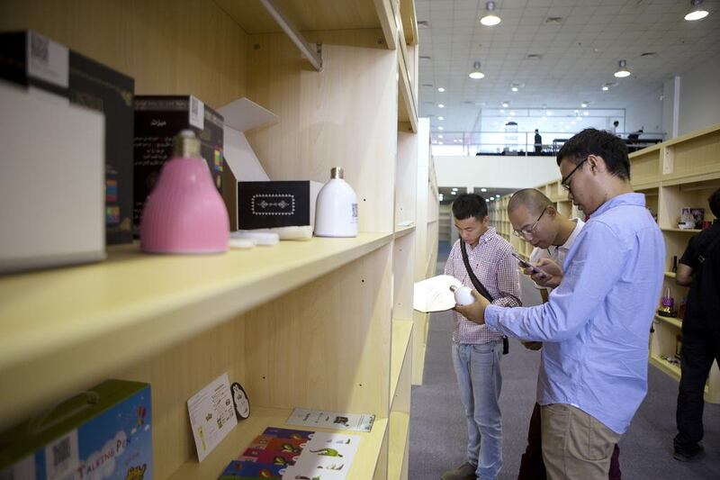 People look at products during the opening of OConnect in Dubai Investment Park. Christopher Pike / The National