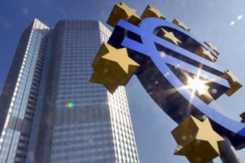 ** FILE ** A Sept. 24, 2007 file photo shows the Euro sculpture in the  sun in front of the European Central Bank ECB building, background, in Frankfurt, Germany. Europe's major central banks banded together with their counterparts in Japan, the U.S. and Canada on Thursday, Sept. 18, 2008, to inject as much as US$180 billion into global money markets in a bid to stave off the growing global financial crisis. (AP Photo/Bernd Kammerer) *** Local Caption ***  FRA118_Europe_Central_Banks.jpg
