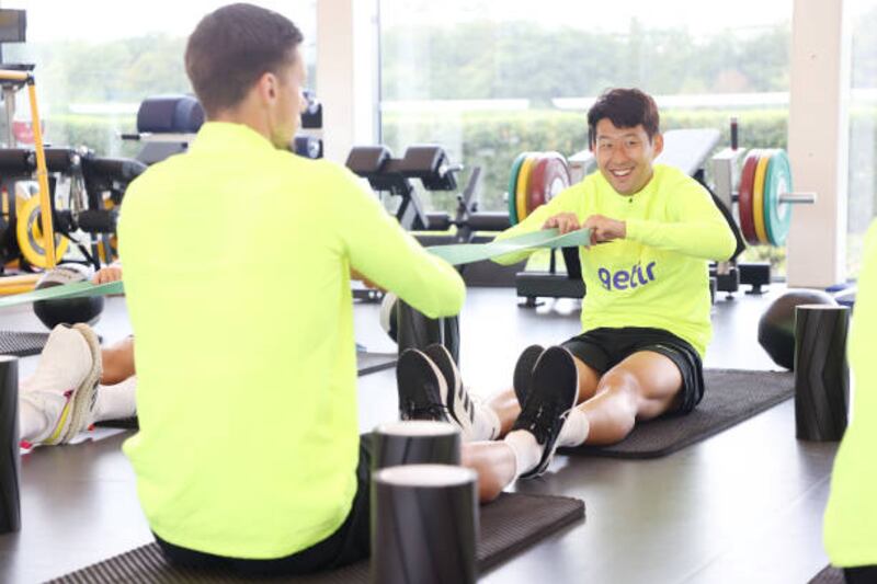 Son Heung-Min stretches during training. Getty Images