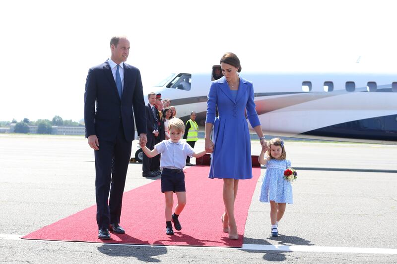 Prince William and Kate with George and Charlotte at Berlin Tegel Airport during an official visit to Poland and Germany in July 2017. Getty