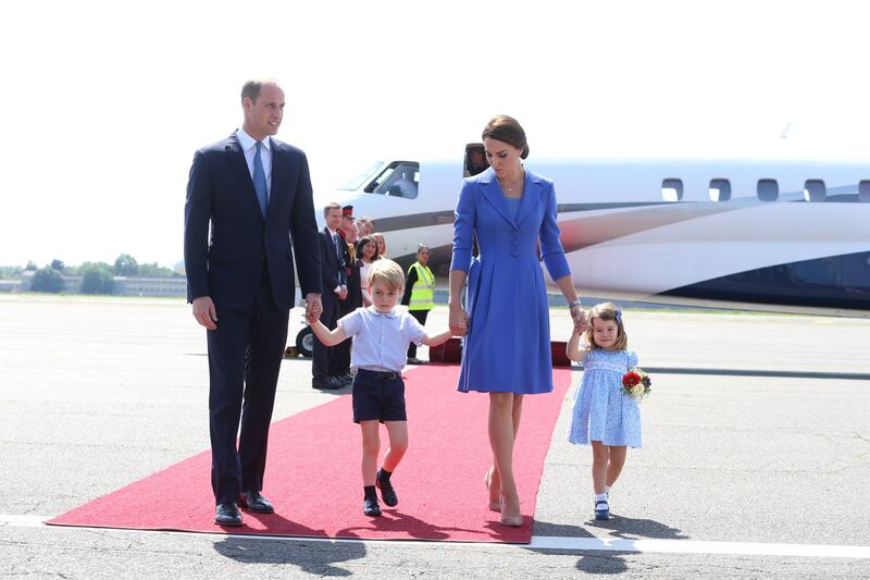 Prince George and Princess Charlotte arrive at Berlin Tegel Airport with their parents in July 2017, during an official visit to Poland and Germany.