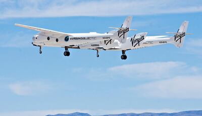The WhiteKnightTwo mothership, carrying SpaceShipTwo, performs a flyover during an event commemorating the completion of the Virgin Galactic Spaceport America runway in Upham, New Mexico, U.S., on Friday, Oct. 22, 2010. Virgin Galactic plans to start test flights next year and will offer commercial space travel within five years, the Wall Street Journal reported in March. Photographer: Christ Chavez/Bloomberg