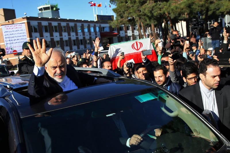 Iranian foreign minister, Mohammad Javad Zarif, who is also Iran's top nuclear negotiator, waves to well-wishers upon arrival at Tehran's Mehrabad airport on April 3, 2015. Ebrahim Noroozi/AP Photo