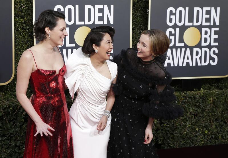 Phoebe Waller-Bridge, host Sandra Oh, and Jodie Comer, who collaborated on Killing Eve, pose together. EPA