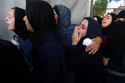 Women grieving at the funeral of Palestinian journalist Hamza Al Dahdouh, the son of Al Jazeera journalist Wael Al Dahdouh. Reuters