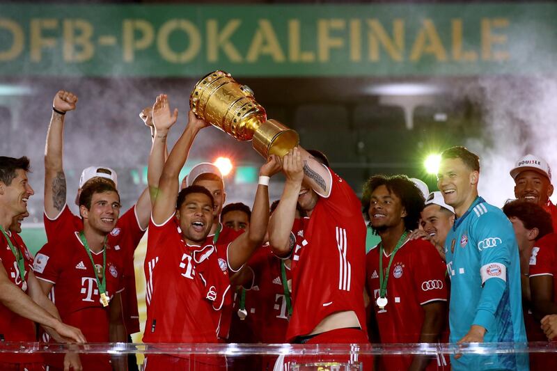 Serge Gnabry lifts the trophy. Getty