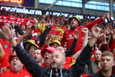 The 'Red Wall' of Wales supporters before the World Cup 2022 play-off final qualifier match against Ukraine at the Cardiff City Stadium in June. AFP