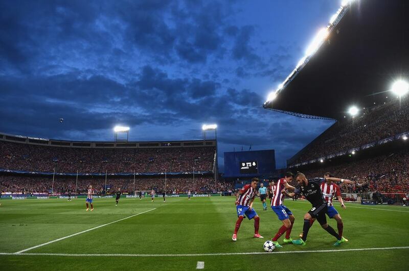 A general view as Karim Benzema of Real Madrid takes on Stefan Savic of Atletico Madrid. Laurence Griffiths / Getty Images