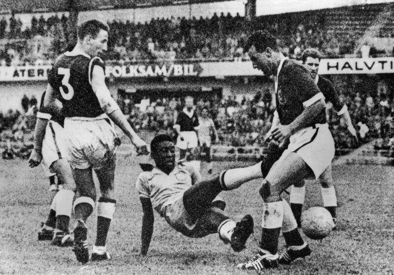 Pele is tackled by two Welsh players during the 1958 quarter final. 