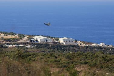 A helicopter flies over a UN base at the Lebanese border town of Naqoura, Lebanon, 28 October. US and UN brokered talks between Lebanese and Israeli delegations in Naqoura finished Thursday. AP Photo