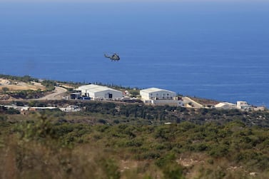 A helicopter flies over a UN base at the Lebanese border town of Naqoura, Lebanon, 28 October. US and UN brokered talks between Lebanese and Israeli delegations in Naqoura finished Thursday. AP Photo