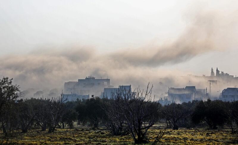 Smoke billows above buildings during an air strike by pro-regime forces on the village of Nayrab, about 14 kilometres southeast of the city of Idlib in northwestern Syria. AFP