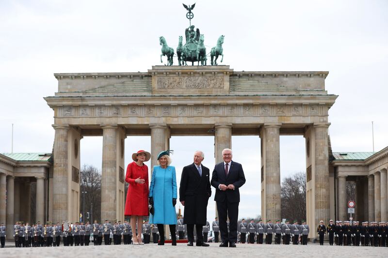 Britain's King Charles III and Queen Consort Camilla with German President Frank-Walter Steinmeier, right, and his wife Elke Buedenbender, left, at the Brandenburg Gate in Berlin. AFP