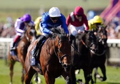 Coroebus, ridden by James Doyle, on the way to winning the 2000 Guineas. PA