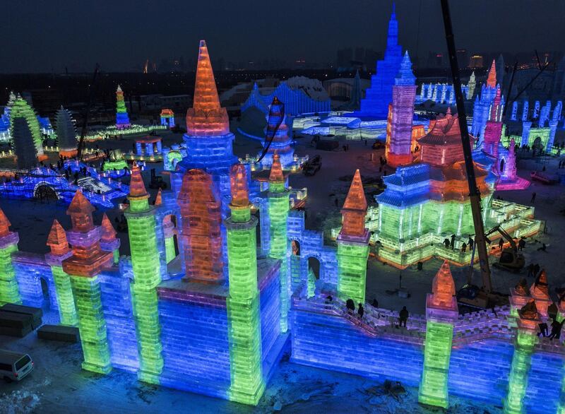 Chinese labourers work to finish large ice sculptures in preparation for the Harbin Ice and Snow Festival. Getty Images